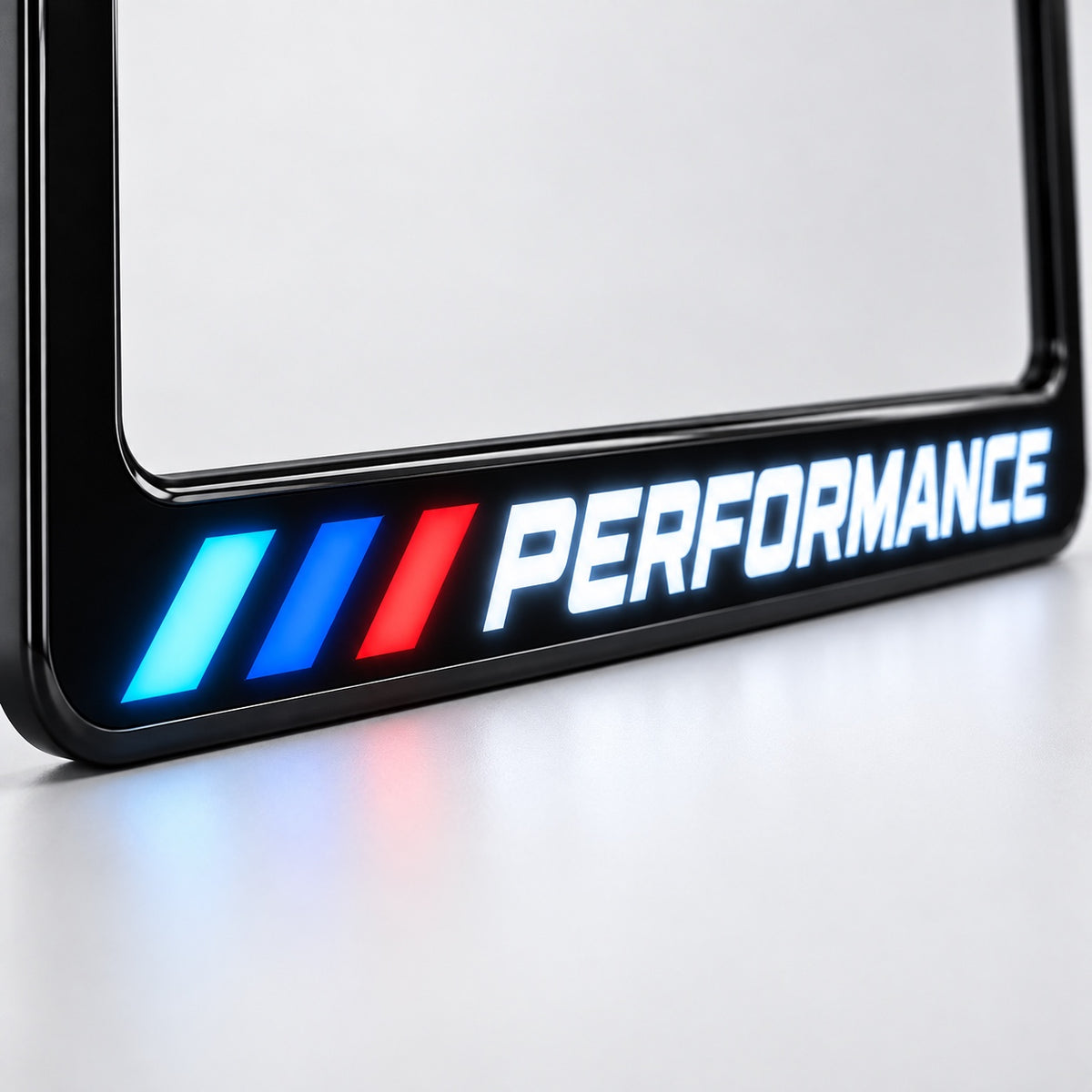 Velor Works illuminated PERFORMANCE license plate frame angled studio view on white background