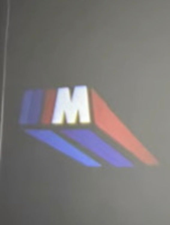 3W USB LED logo projector showing the Velocity tri-color projection