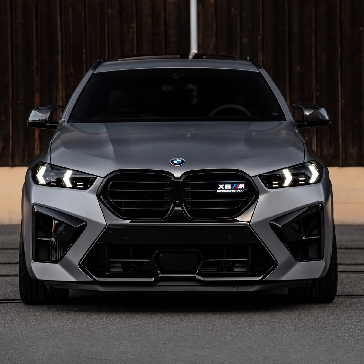 X6 M Competition illuminated grille emblem on a gray BMW (edited design visualization)